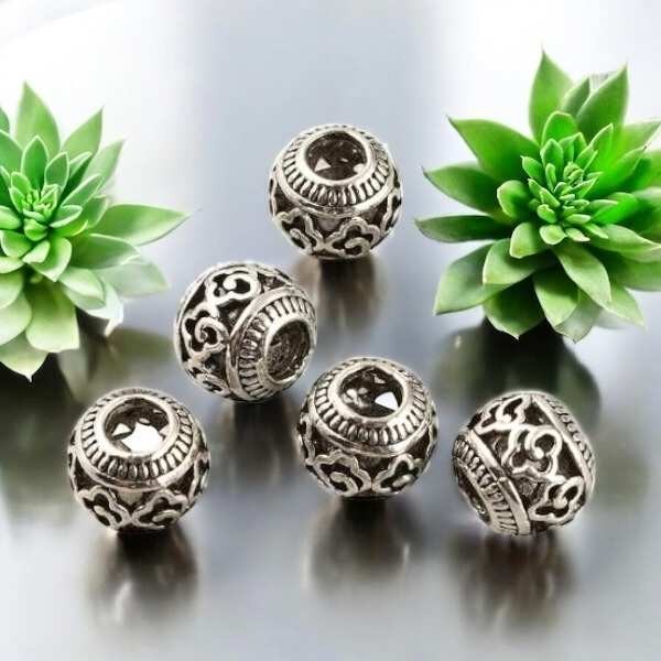 5 perles tibetaines ciselees design argentees pour cuir 4mm