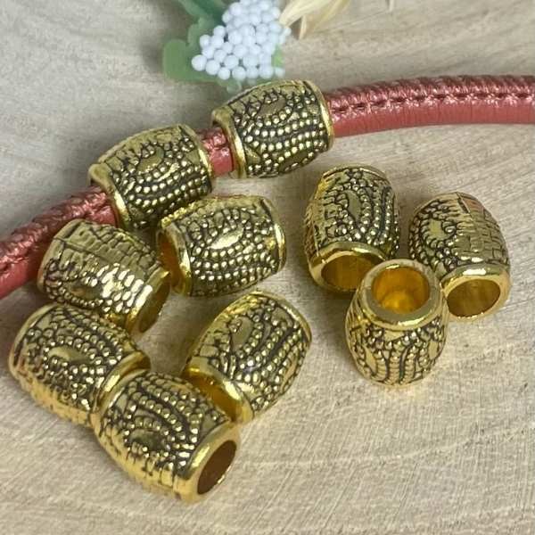 10 perles ciselees ethniques baril tibetain dore antique interieur 4mm