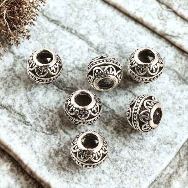 5 perles tibetaines ciselees vagues argentees pour cuir 4mm