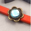 passe cuir verre turquoise et metal bronze 23mm pour cuir regaliz