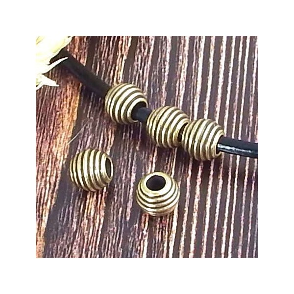 10 Perles striees metal zamak plaqué bronze pour cuir 2 a 3mm