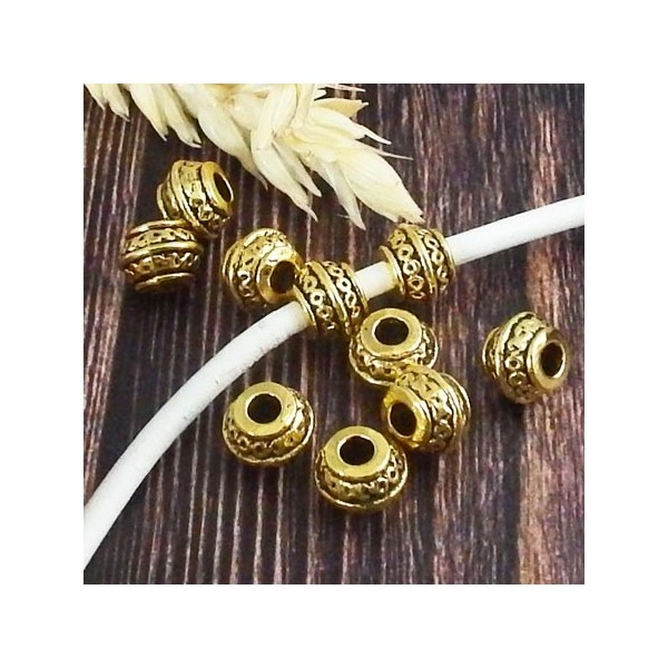 10 perles ciselees ethniques style tibetain dore antique interieur 3mm