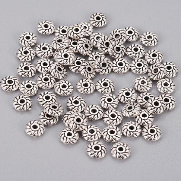 50 perles tibetaines rondelles rosaces argentees pour cuir 1mm